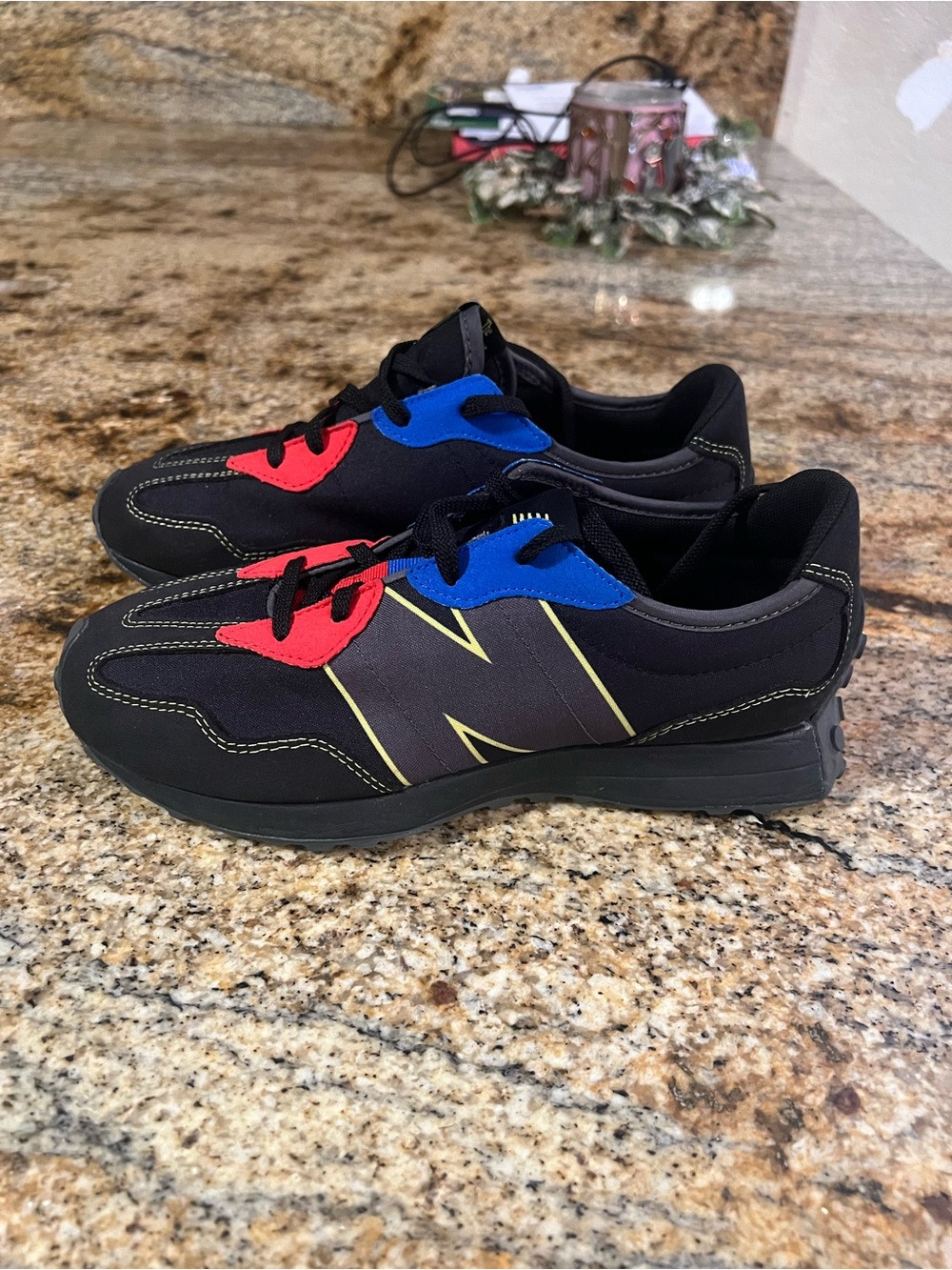 New Balance Black Sneakers with Red and Blue Accents